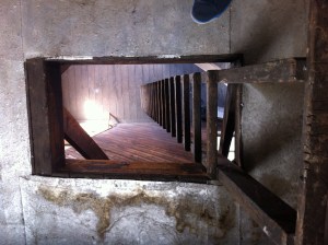 The trap door and ladder leading up to the clock tower