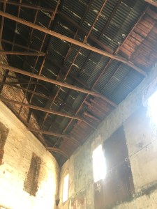 Some of the old wooden ceiling showing