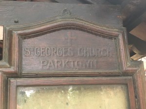 Wooden sign at the lynch gate