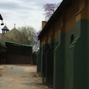 View of the side of the building with St. Alban's in the background